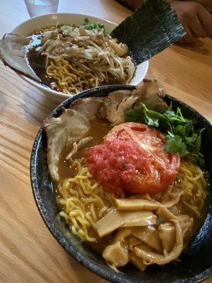 Tomato curry ramen with pork, bamboo and extra noods. In the back is the garlic shoyu ramen with corn and extra noods.