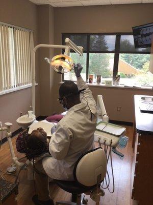 Dr Vertil providing dental care to a great patient.