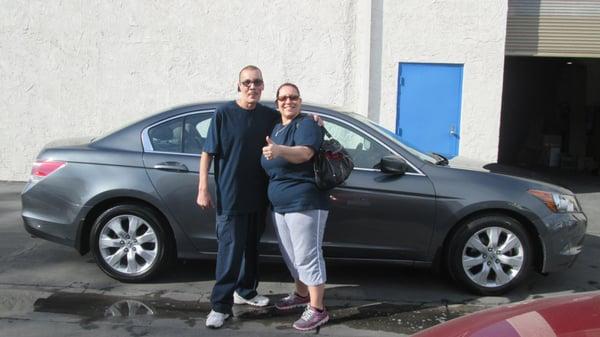 Happy couple taking home their 2010 Honda Accord EX