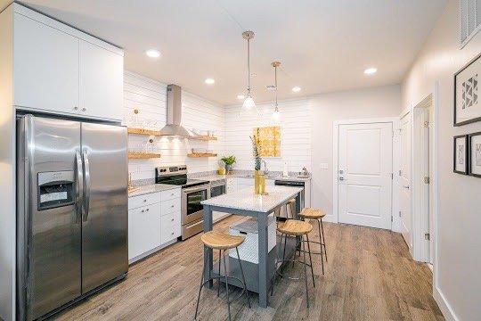 Kitchen, stainless steel, shiplap walls, luxury apartments