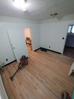 During: After subsurface was prepped, the installation of the hardwood began. Light sanding was down to ready the wood for finish.