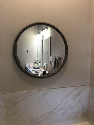 Hang Mirror in bathroom of are new home