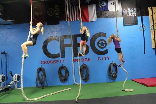 Coach Carrie and two of her firebreathers in our CrossFit Kids Program