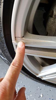 I was able to scratch this off with my fingernail. They did a horrible job cleaning the wheels!