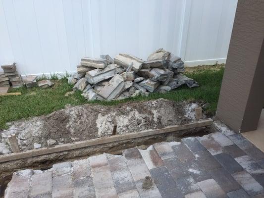 Smashed up pavers and more dirt on lawn. About 2 weeks like this