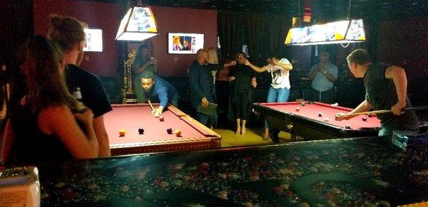 Anthony Anderson playing pool with locals.