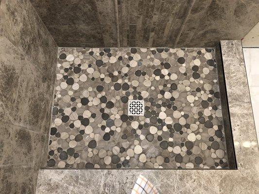 Marble flat pebble shower floor