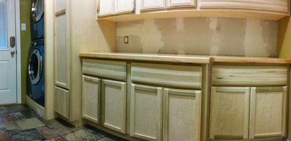 Lower cabinets of a laundry room renovation.