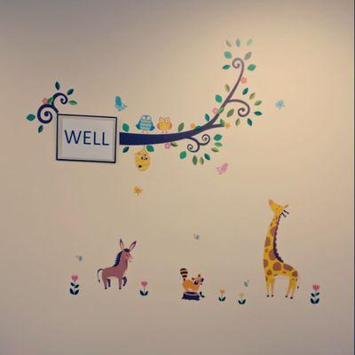 Wellness waiting room wall , designed by our staff, Angel!