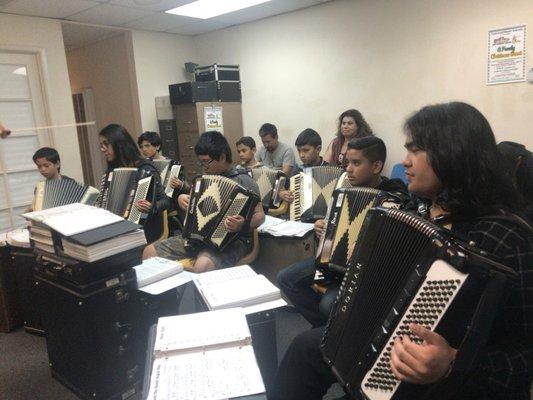 Kids practicing for their Christmas 2017 music performance.