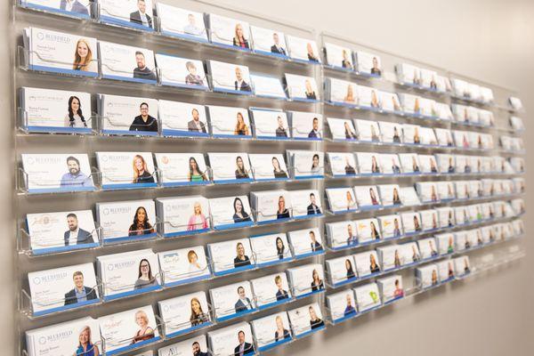 You can find the business cards for all of our Greenville agents on this wall in the Greenville office!