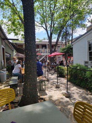 Sitting outside the shop, listening to some live music.