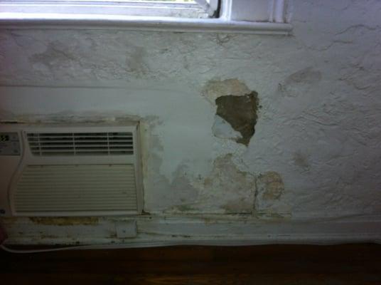 This is one of the pictures I sent to the property manager when they bought our building 4 months ago. Leak in the wall from AC