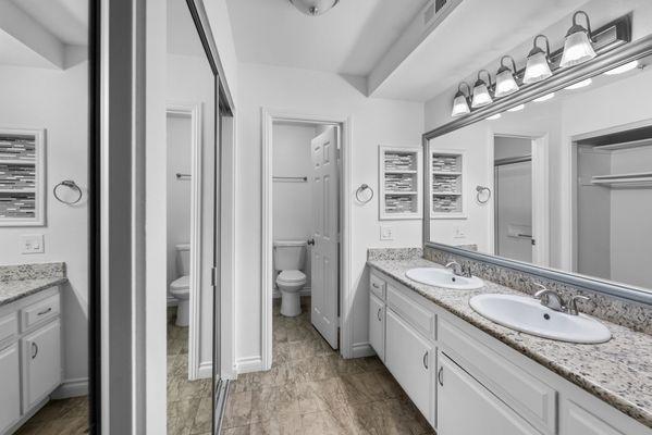 Stunning vanity and counter space.