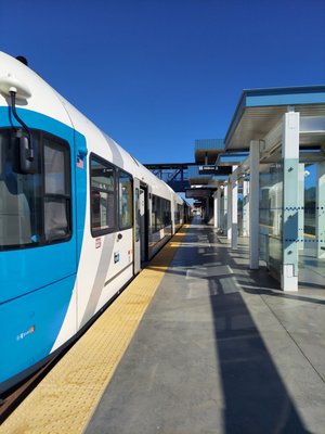 Platform with train in station