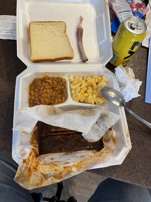 Barbecue food, some ribs, baked beans, mac & cheese, and Bread.