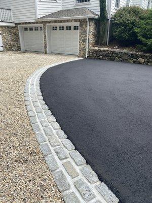 Paved driveway and installed Belgian block