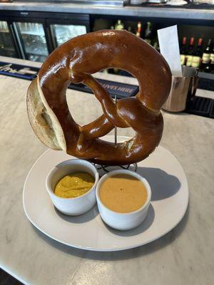 Pretzel with cheese sauce