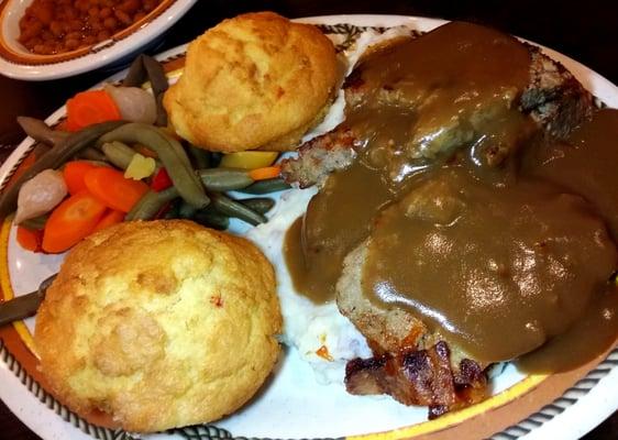 Meat Loaf stacked on Garlic Mashed Potatoes with Vegetable Medley.