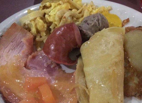 Ham, kluski with eggs, kielbasa, potato pancake with applesauce, crepe.