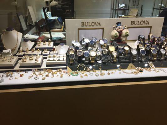 Front display window depicting diamond rings and Bulova watches