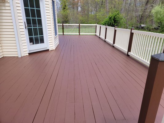 2022 deck repairs and restoration  .freshly repainted railings and decking .This came out great !