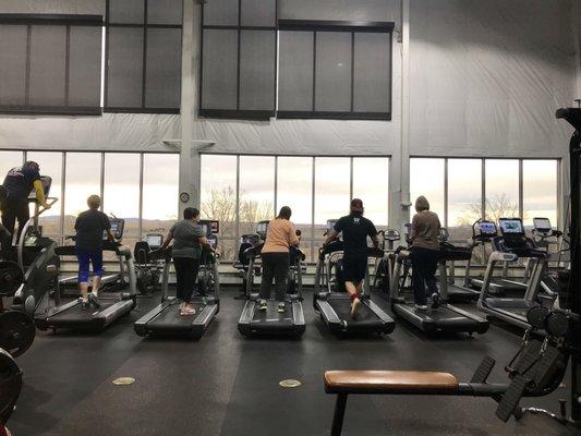 Line of treadmills by the huge windows, great view!