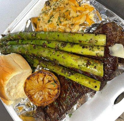 Steak dinner accompanied with Grilled Asparagus and lobster Mac!!!