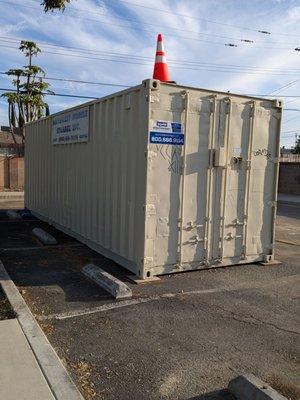 Shipping container in the parking lot