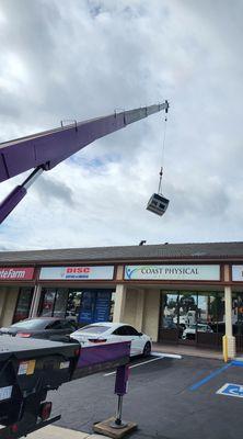 Using the big crane to install our new A/C Heating unit