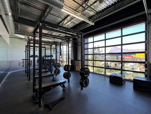 Some free weights and fitness equipment in a dedicated area