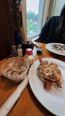 Asiago Bagel with bacon, egg and cheddar. Blueberry pancakes, and parfait.