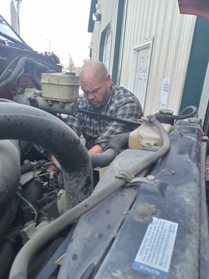 Replacing valve cover. & gaskets on a dump truck