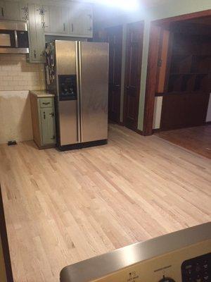 Kitchen floor installed in one day. Before finish.