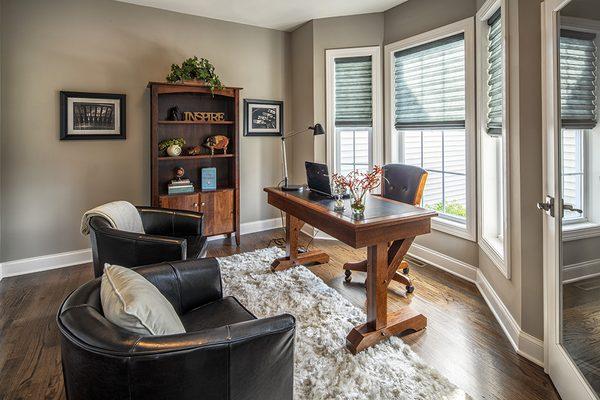 Home office with angle bay windows