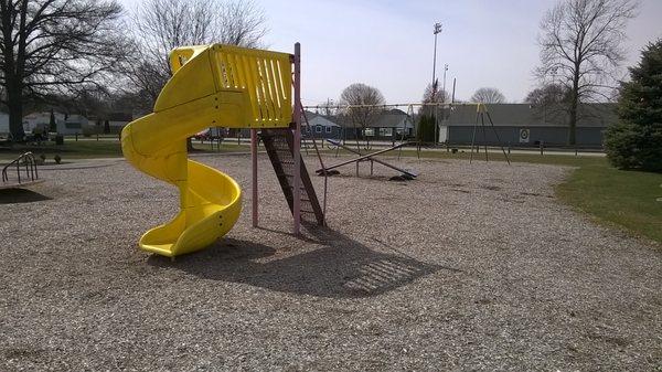 swings and a slide on the playground