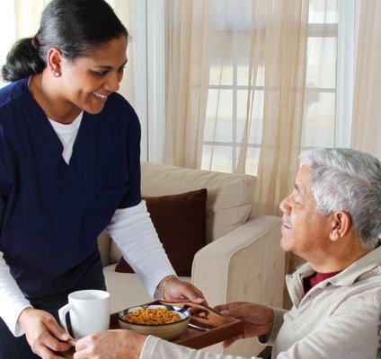 Caregiver assisting with meals