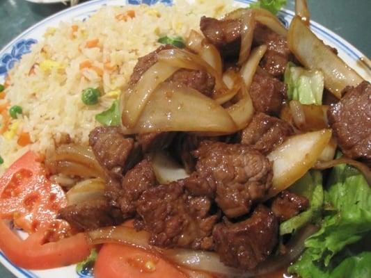 Beef cubes over fried rice