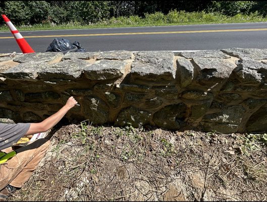 Tuck pointing joints on stone wall for skyline dr