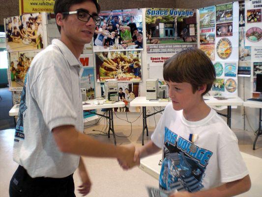 Flight Director congratulating a cadet at camp. Job Well done!