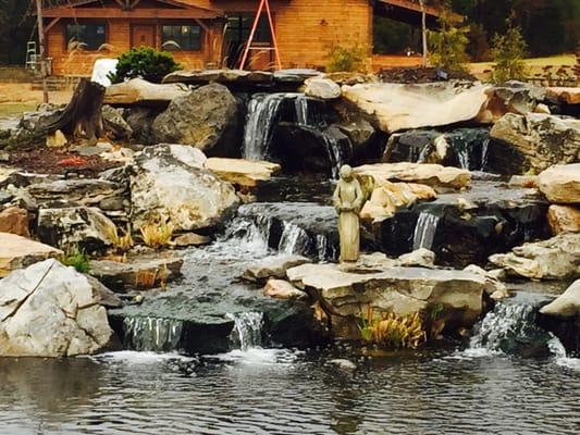 Large recreational pond and waterfall that adds beauty and tranquility to the landscape.