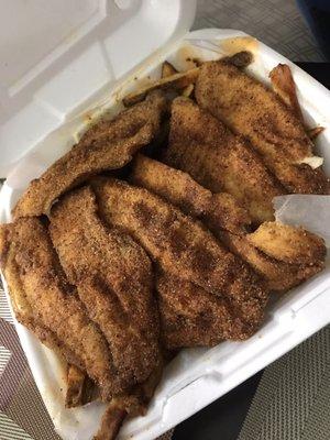 Tilapia on a bed of fries