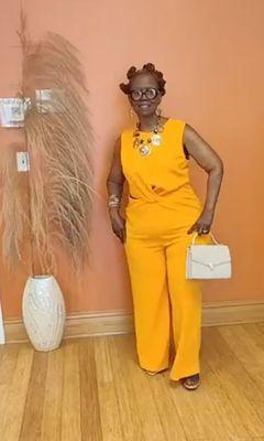 Hot tangerine orange sleeveless jumpsuit.