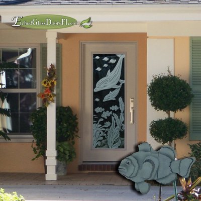 glass front entry door with dolphin etching design