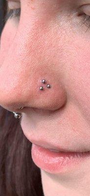 Triple nostril piercing