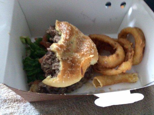 As you can see, well, done  burger.. Side of onion rings $1.79