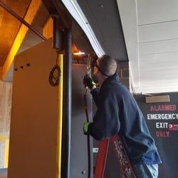 Technician repairing a Bi-Fold Door