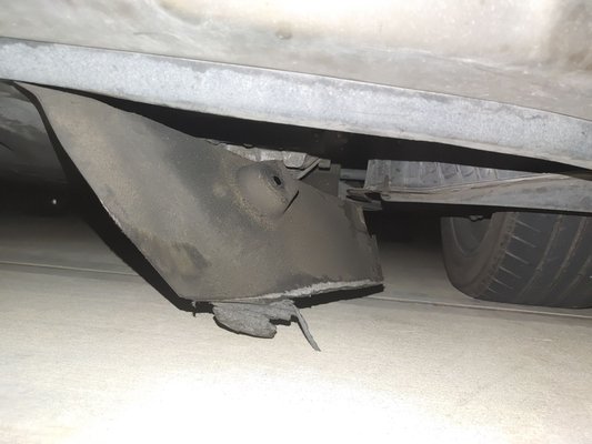 Damaged undercarriage cover