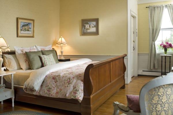 The Sanborn Room features a king bed, Comphy Sheets, 2 chairs and an attached bath,