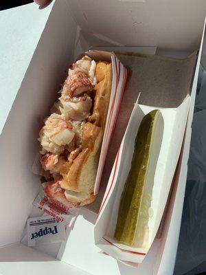 Hot buttered lobster roll w/ pickle spear